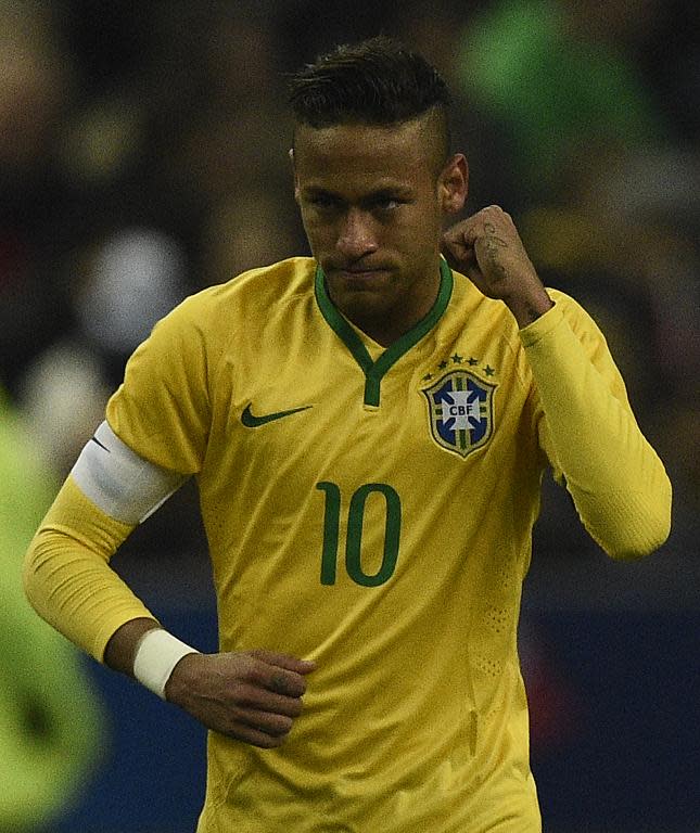 Brazil's Neymar celebrates after scoring a goal during their friendly match against France, at the Stade de France in Saint-Denis, north of Paris, on March 26, 2015