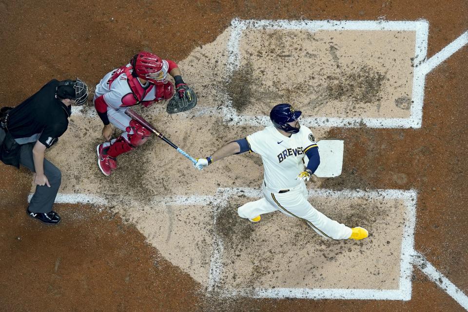 Milwaukee Brewers' Rowdy Tellez hits a grand slam during the third inning of a baseball game against the Cincinnati Reds Wednesday, May 4, 2022, in Milwaukee. (AP Photo/Morry Gash)