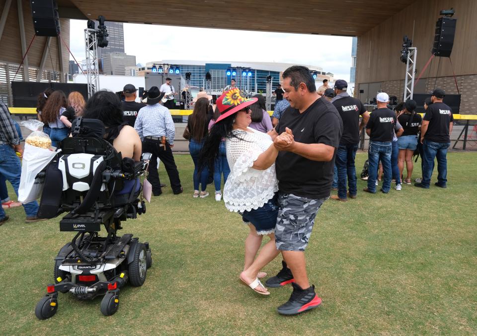 A couple dances to the music during the 2021 Cinco de Mayo celebration at Scissortail Park.