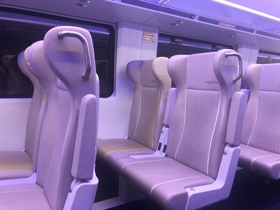 Plush, empty seats on a Brightline train 