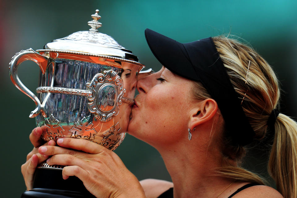 Maria Sharapova of Russia kisses the Coupe Suzanne Lenglen in the women's singles final against Sara Errani of Italy during day 14 of the French Open at Roland Garros on June 9, 2012 in Paris, France. (Photo by Mike Hewitt/Getty Images)