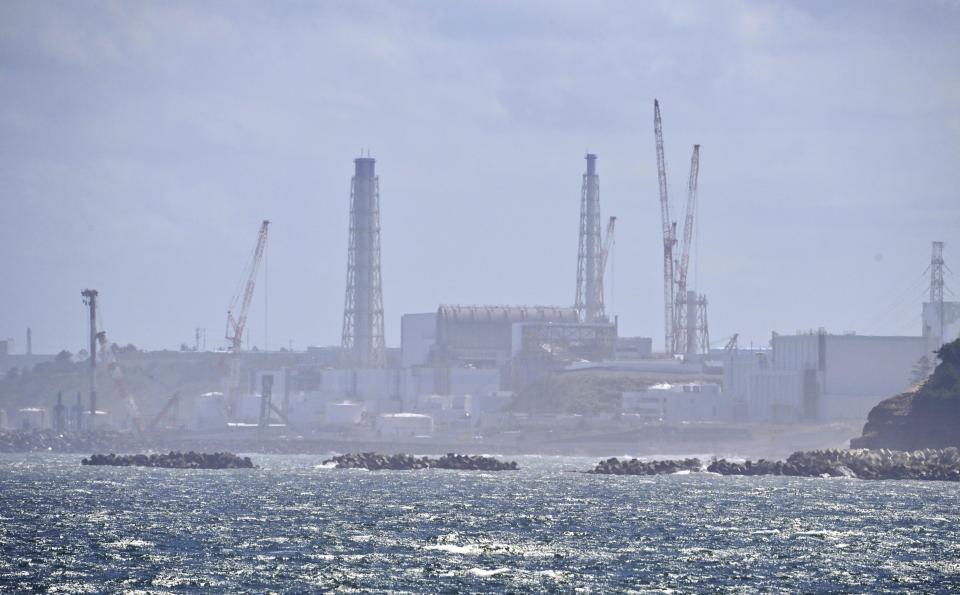 The Fukushima Daiichi nuclear power plant is seen in Namie, Fukushima prefecture, northern Japan, Thursday, Aug. 24, 2023. The operator of the tsunami-wrecked Fukushima Daiichi nuclear power plant says it has begun releasing its first batch of treated radioactive water into the Pacific Ocean — a controversial step, but a milestone for Japan’s battle with the growing radioactive water stockpile.(Kyodo News via AP)