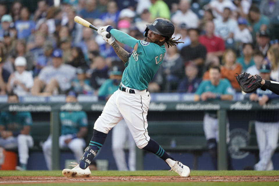 Seattle Mariners' J.P. Crawford hits an RBI double during the third inning of the team's baseball game against the Toronto Blue Jays, Friday, July 8, 2022, in Seattle. (AP Photo/Ted S. Warren)