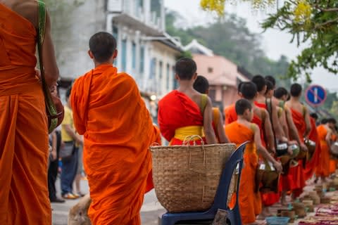Monks collecting alms - Credit: GETTY