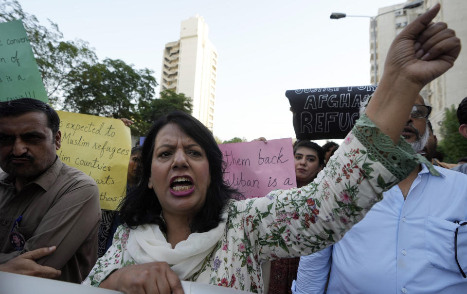 A social group, Aurat March, hold signs during a demonstration against Pakistani government, in Karachi, Pakistan, Sunday, Oct. 29, 2023. Pakistan says it has recently announced plans to deport all migrants who are in the country illegally, including 1.7 million Afghans, who will be implemented in a "phased and orderly manner." (AP Photo/Fareed Khan)