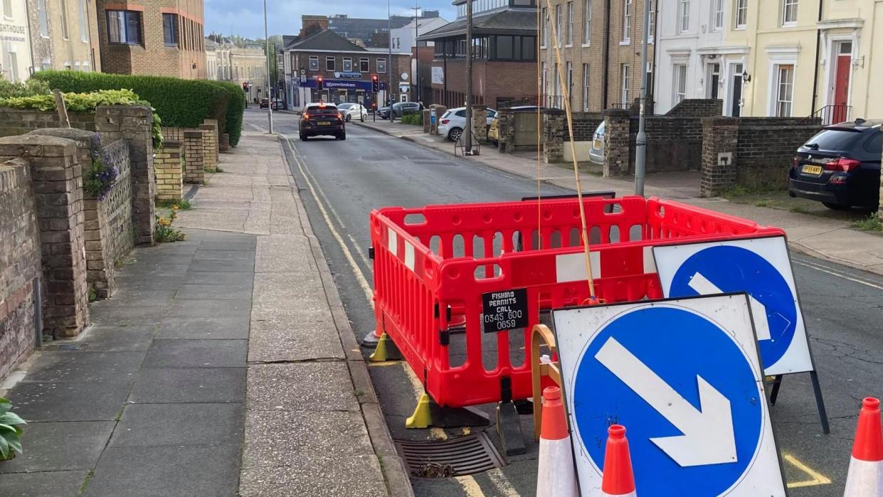 Barriers around a sinkhole on High Street in Ipswich