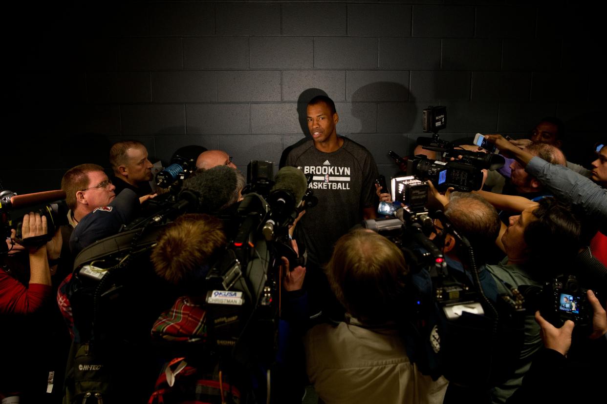 Collins speaks to the media after signing with the Nets. (Justin Edmonds/Getty Images)