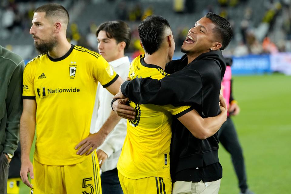 Oct 1, 2022; Columbus, Ohio, USA;  Columbus Crew forward Cucho Hernandez, who was suspended for the match, hugs midfielder Lucas Zelarayan (10) following the MLS soccer game against the New York Red Bulls at Lower.com Field. The Crew won 2-1. Mandatory Credit: Adam Cairns-The Columbus Dispatch