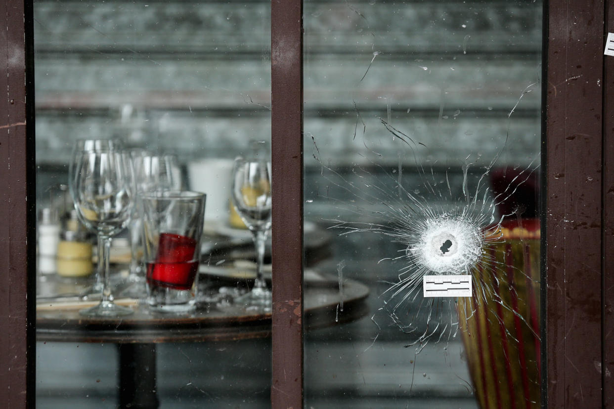 A bullet hole through the glass door of a cafe (Christopher Furlong / Getty Images file)
