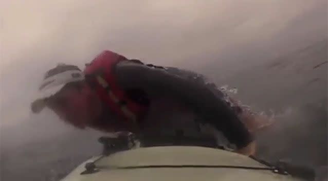 The scared kayaker was able to scramble back on board. Source: YouTube.