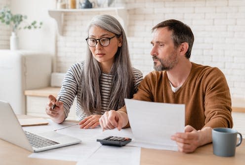 <span class="caption">Budgeting for a rising cost of living.</span> <span class="attribution"><a class="link " href="https://www.shutterstock.com/image-photo/mature-middleaged-couple-family-wife-husband-1994498774" rel="nofollow noopener" target="_blank" data-ylk="slk:Inside Creative House/Shutterstock;elm:context_link;itc:0">Inside Creative House/Shutterstock</a></span>