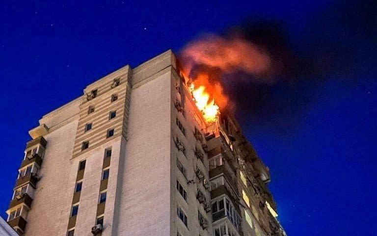 An apartment building burns after being damaged during a massive Russian drone strike - Reuters