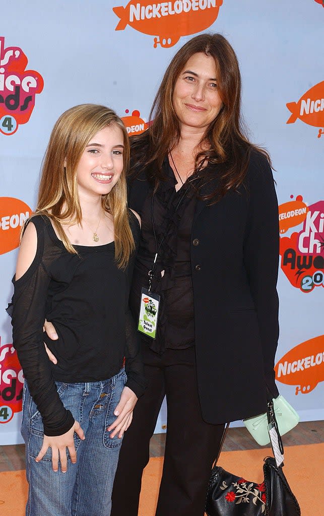 Emma as a kid with her mom on carpet with a Nickelodeon logo