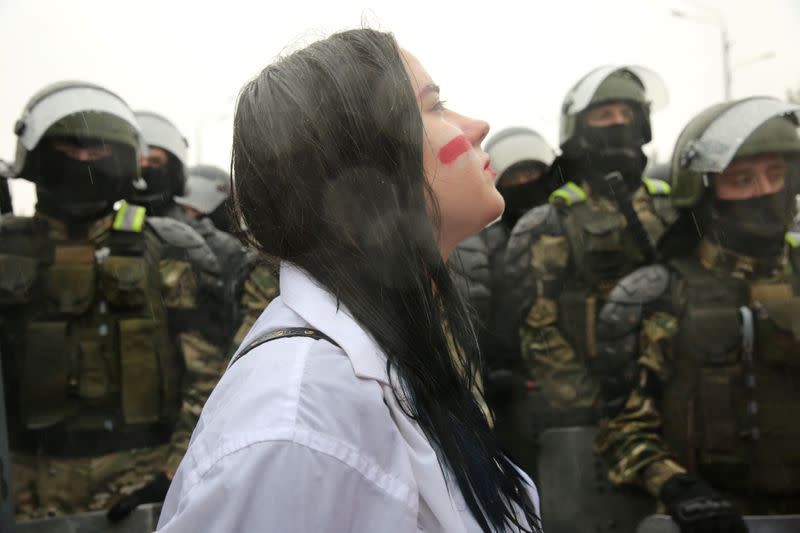 People attend an opposition rally to reject the presidential election results in Minsk