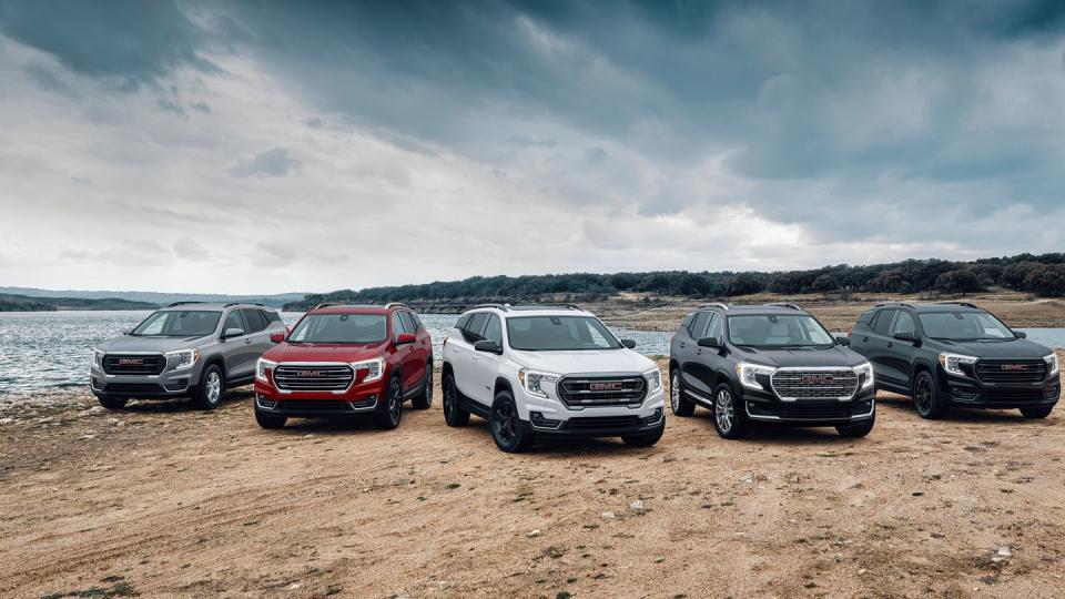 front group view of the 2024 gmc terrain lineup, including sle, slt, at4 and denali trims and available elevation edition