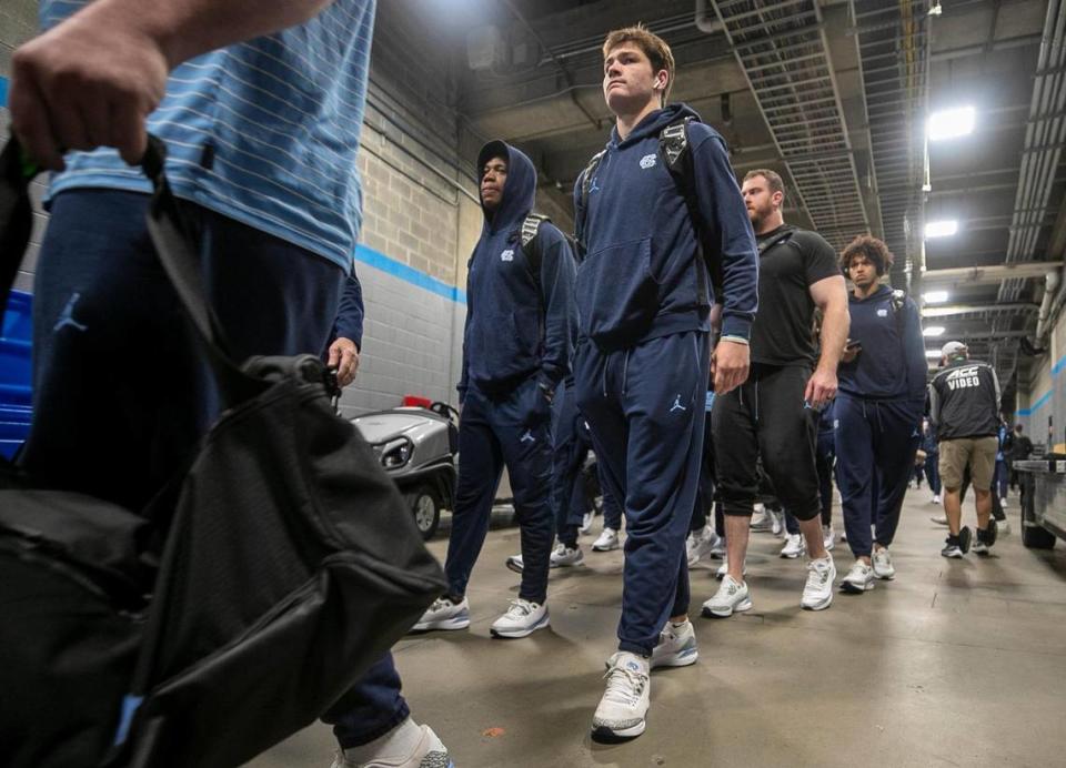 North Carolina quarterback Drake Maye (10) and his teammates arrive for the ACC Championship game against Clemson on Saturday, December 3, 2022 at Bank of American Stadium in Charlotte, N.C.