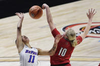 Louisville's Hailey Van Lith, right, blocks a shot attempt by DePaul's Sonya Morris during the first half of an NCAA college basketball game Friday, Dec. 4, 2020, in Uncasville, Conn. (AP Photo/Jessica Hill)