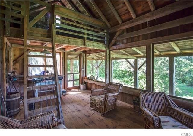 <p>The secluded escape with its wood floors and beamed ceilings feels like a cottage. (Realtor.com) </p>