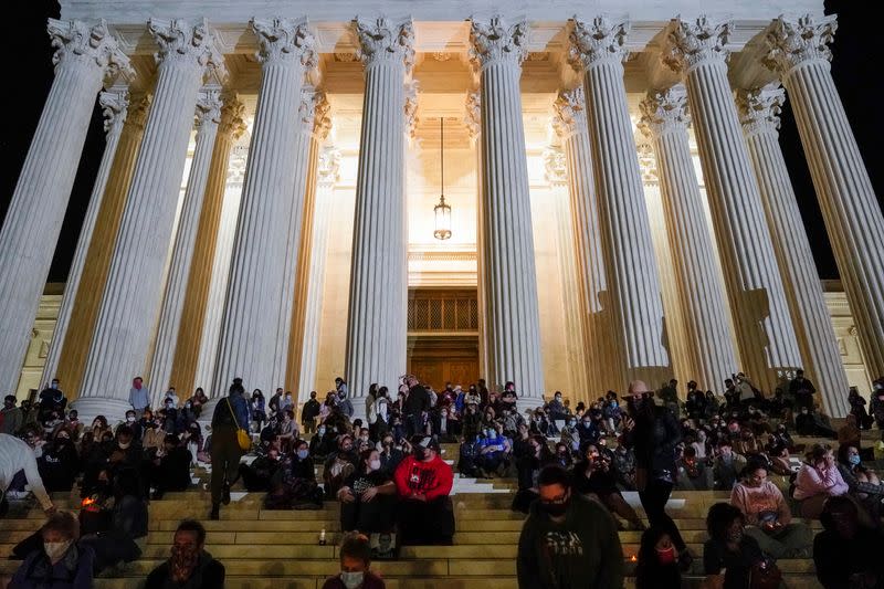 People mourn the death of Associate Supreme Court Justice Ruth Bader Ginsburg at the Supreme Court in Washington