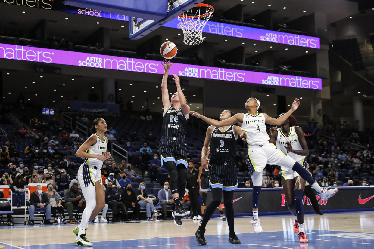 Chicago Sky guard Courtney Vandersloot (22) shoots against the Dallas Wings during the first half in the first round of the WNBA basketball playoffs, Thursday, Sept. 23, 2021, in Chicago. (AP Photo/Kamil Krzaczynski)