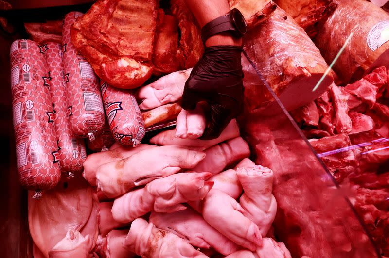 Pieces of porks are seen at a market stall in Madrid