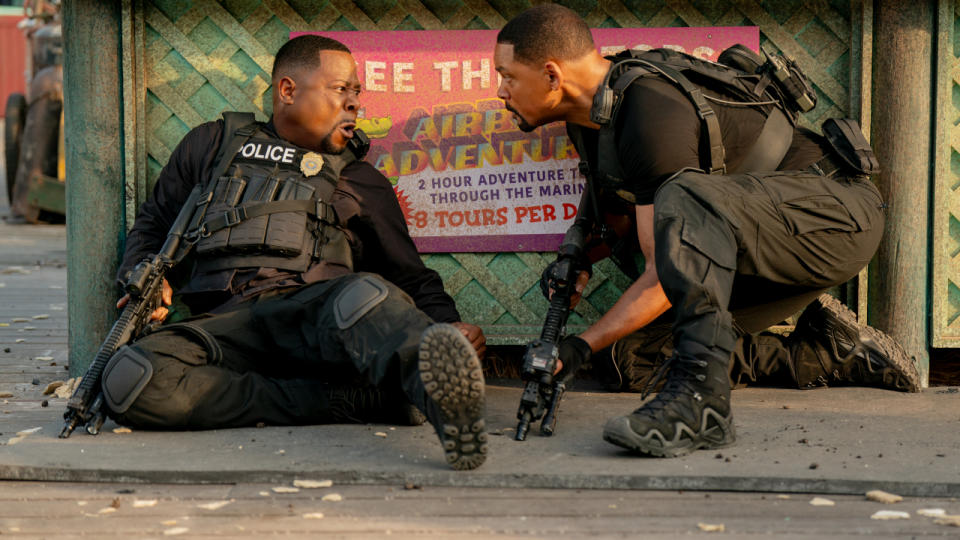 Martin Lawrence and Will Smith in conversation as they take cover in Bad Boys: Ride or Die.