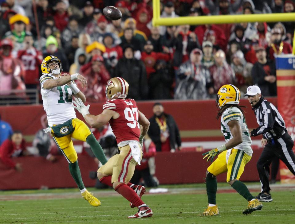 Green Bay Packers quarterback Jordan Love throws an interception to San Francisco 49ers linebacker Dre Greenlaw late in the fourth quarter.