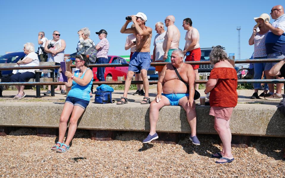 People watch as the container ship Ever Given arrives at the Port of Felixstowe (Aaron Chown/PA) (PA Wire)