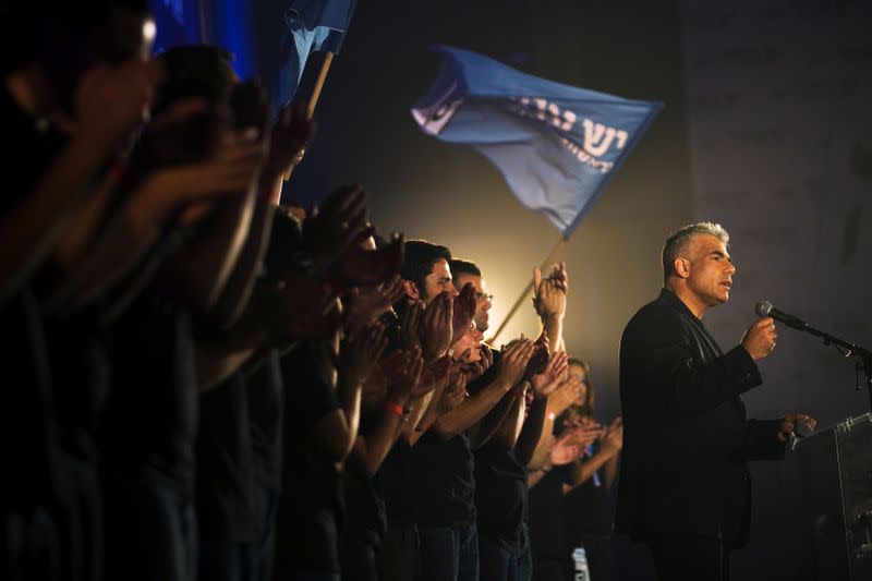 FILE PHOTO: Yair Lapid, head of Yesh Atid party, speaks to supporters during a conference in Holon near Tel Aviv