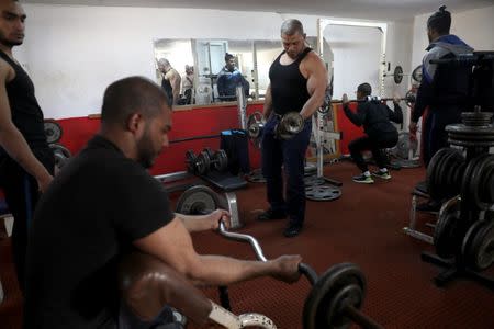 Ibrahim al-Masri, trains at a gym, on his last day as the chief muezzin of the Al-Jazzar Mosque, in Acre, northern Israel January 31, 2019. REUTERS/Ammar Awad