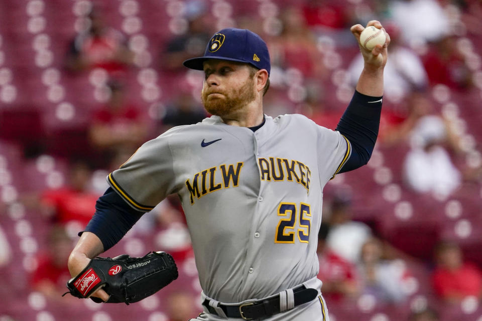 Milwaukee Brewers starting pitcher Brett Anderson winds up during the first inning of the team's baseball game against the Cincinnati Reds in Cincinnati on Wednesday, June 9, 2021. (AP Photo/Jeff Dean)