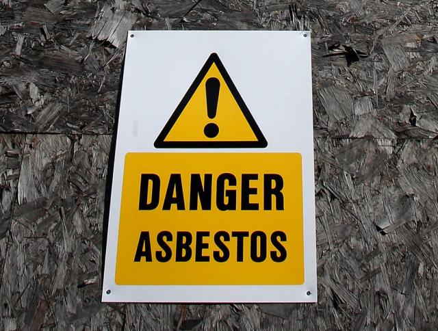 An asbestos warning sign (Stephen Pond/PA) (PA Archive)