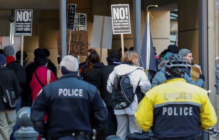 Demonstrators protest against President Donald Trump's revised travel ban outside the offices of the U.S. Immigration and Customs Enforcement in Chicago, Illinois, U.S., March 16, 2017. REUTERS/Kamil Krzaczynski