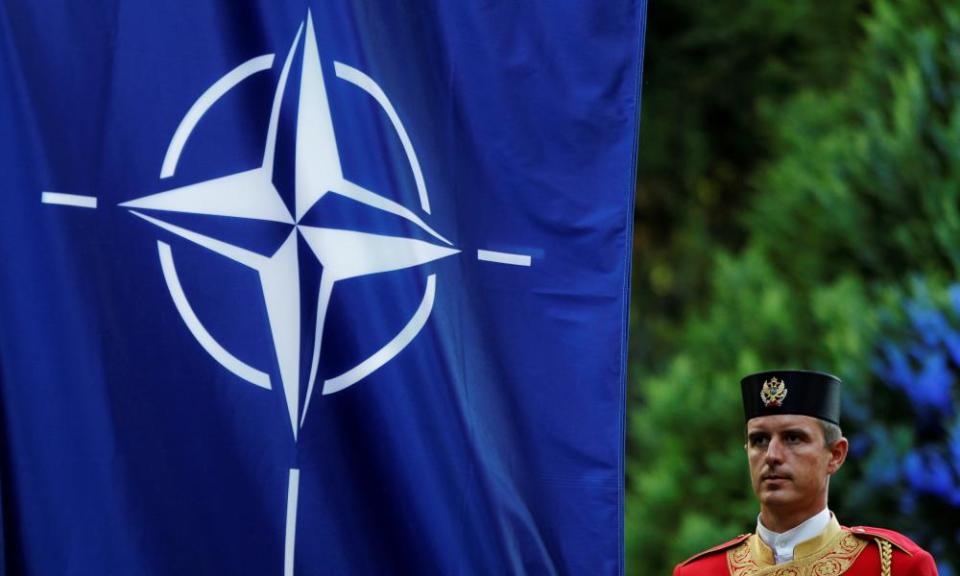 A Montenegrin guard of honour stands next to Nato flag during a ceremony to mark Montenegro’s accession to the organisation in June 2017.