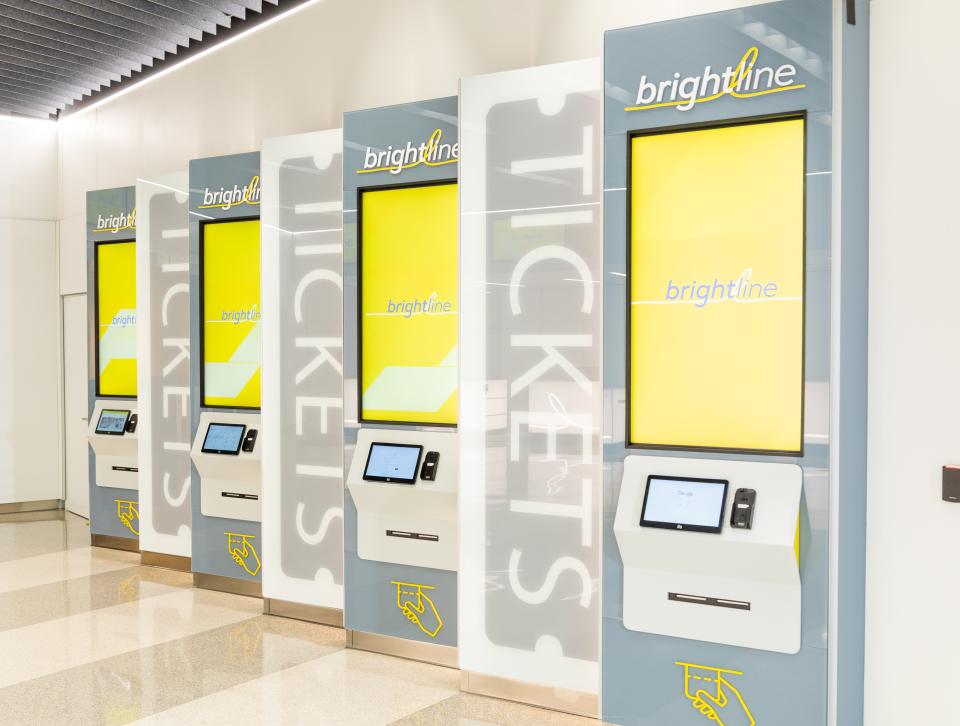 Brightline train station, Orlando International Airport, Florida, self-service kiosks.