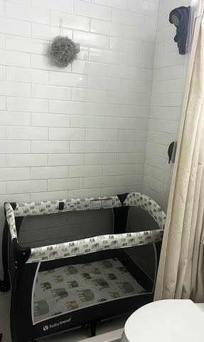 <p>Chloe Molina</p> Chloe Molina puts baby crib in shower when she travels