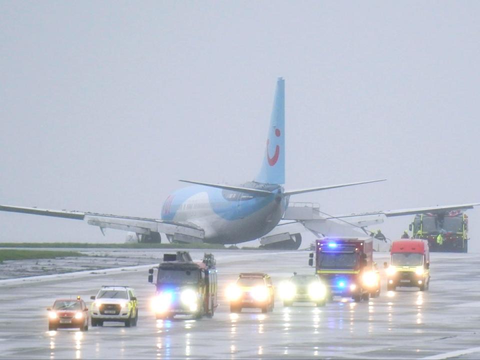 Emergency services at the scene after a passenger plane came off the runway at Leeds Bradford Airport while landing in windy conditions during Storm Babet (Danny Lawson/PA Wire)