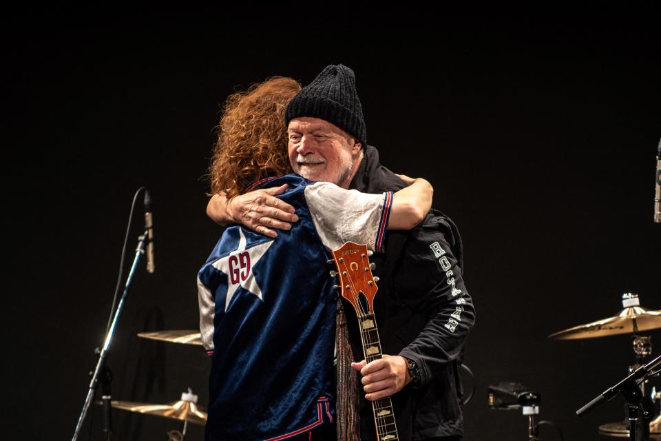 Japanese musician Takeshi (left) embraces Canadian guitarist Randy Bachman after Bachman received his original Gretsch 6120 Chet Atkins guitar during a Canada-Japan Friendship Concert to coincide with Canada Day at the Canadian Embassy in Tokyo, July 1, 2022. / Credit: PHILIP FONG/AFP/Getty