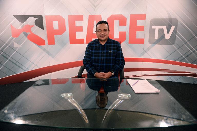 Jatuporn Prompan, chairman of the Red Shirts movement, pose for a picture ahead of his live show on Peace TV, on October 10, 2014