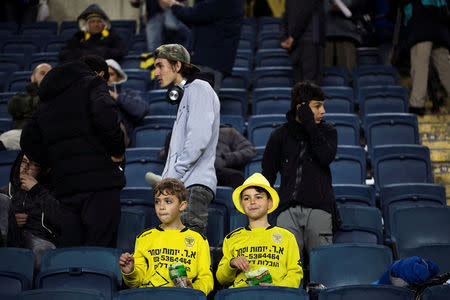 Children supporting Betar Nordia Jerusalem sit in stands during a match at Teddy Stadium in Jerusalem, January 29, 2018. Picture taken January 29, 2018. REUTERS/Ronen Zvulun