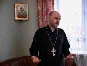 After preaching about the human cost of the ongoing fighting, Father Ioann Burdin, 50, was summoned for questioning by investigators and later ordered to pay a fine (AFP/Yuri KADOBNOV)