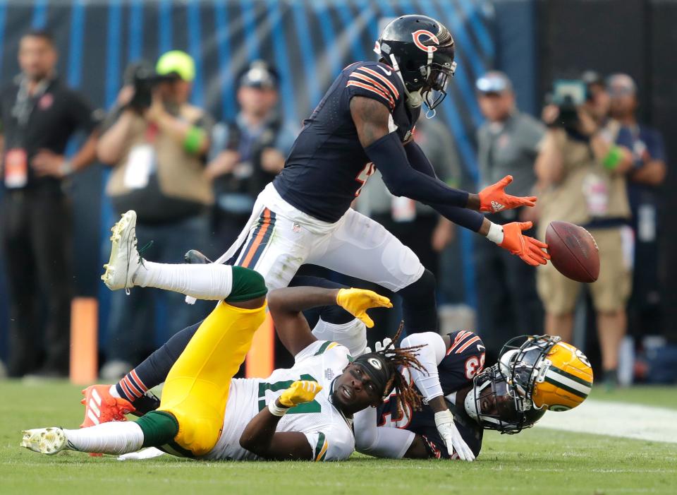 Green Bay Packers wide receiver Jayden Reed (11) loses his helmet as Chicago Bears safety Eddie Jackson (4) and cornerback Jaylon Johnson (33) defend to force an incompleted pass during their football game Sunday, September 10, 2023, at Soldier Field in Chicago, Ill. Green Bay won 38-20.