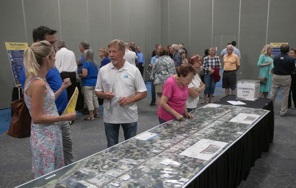 Lakeland residents and city officials gather in Sikes Hall during the South Florida Avenue Road Diet Project Public Meeting at the RP Funding Center in Lakeland Monday evening.