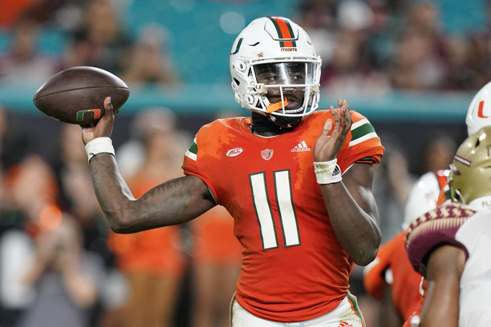 Miami quarterback Jacurri Brown (11) stands back to throw during the second half of an NCAA college football game against Florida State, Saturday, Nov. 5, 2022, in Miami Gardens, Fla. (AP Photo/Lynne Sladky)