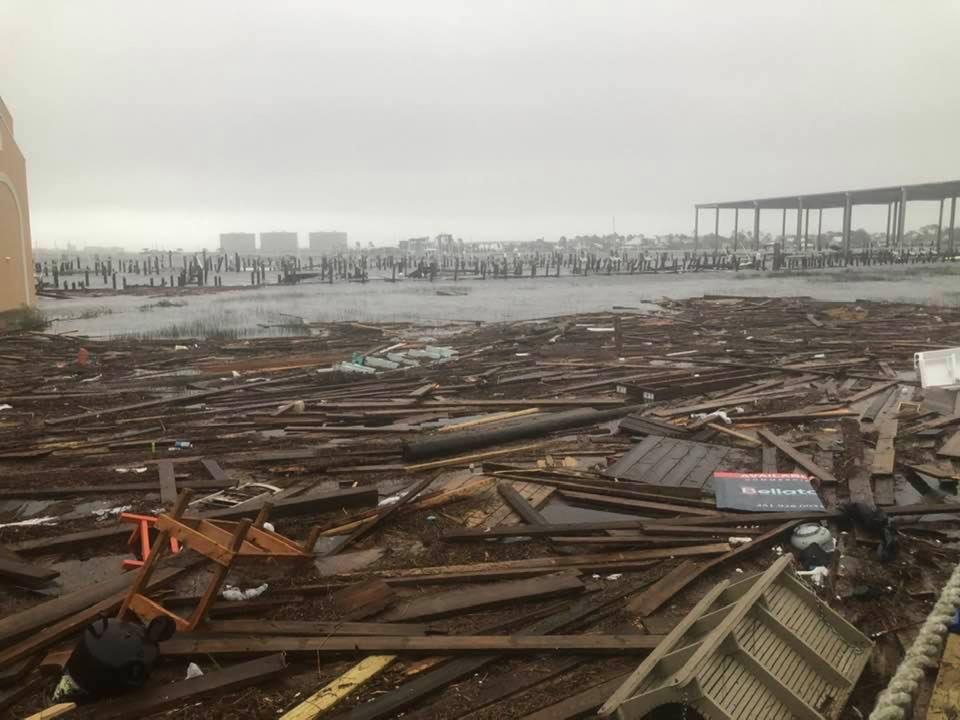 Debris and flood damage in Orange Beach from Hurricane Sally on Wednesday.