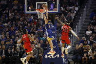 Golden State Warriors guard Klay Thompson (11) shoots against Toronto Raptors forward Scottie Barnes (4) and guard Gary Trent Jr. (33) during the first half of an NBA basketball game in San Francisco, Friday, Jan. 27, 2023. (AP Photo/Jed Jacobsohn)