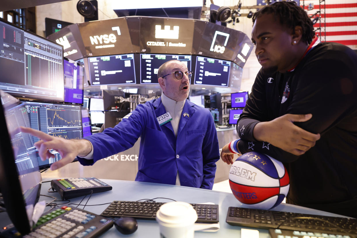ftse NEW YORK, NEW YORK - FEBRUARY 23: Harlem Globetrotter Harlem Globetrotter player Hot Rod De La Rosa talks with trader Pete Giacchi on the floor of the New York Stock Exchange during morning trading on February 23, 2024 in New York City. The market opened continuing its rise after yesterdays closing with the S&P 500, the Nasdaq Composite posting their best day since early 2023 and the Dow Jones surpassing 39,000 for the first time ever amid Nvidia reporting a stronger-than-expected quarterly results. (Photo by Michael M. Santiago/Getty Images)