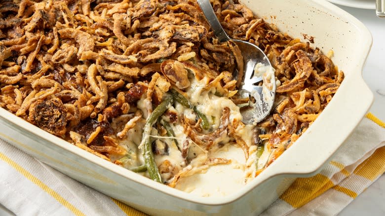 Scooping cooked green bean casserole