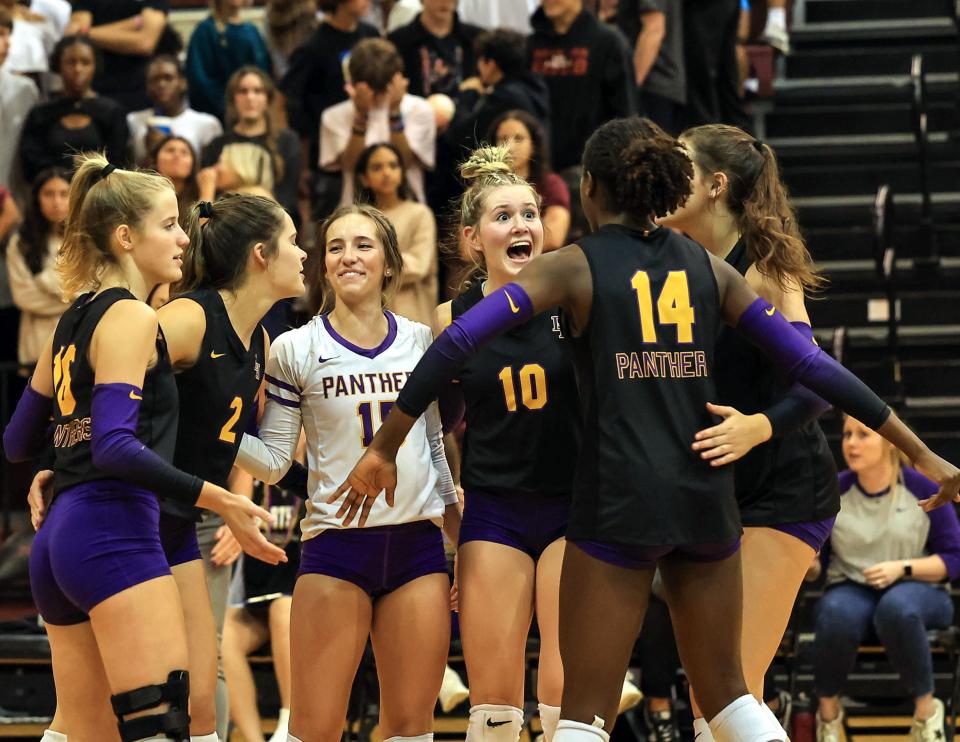 Liberty Hill players celebrate winning the second set against Rouse on Oct. 17. Last Saturday, the Panthers got past Rouse again, this time in the Class 5A regional finals that sent them to the UIL state volleyball tournament for the second year in a row. "Liberty Hill has high standards, but with a small-town feel," head coach Marie Bruce said.