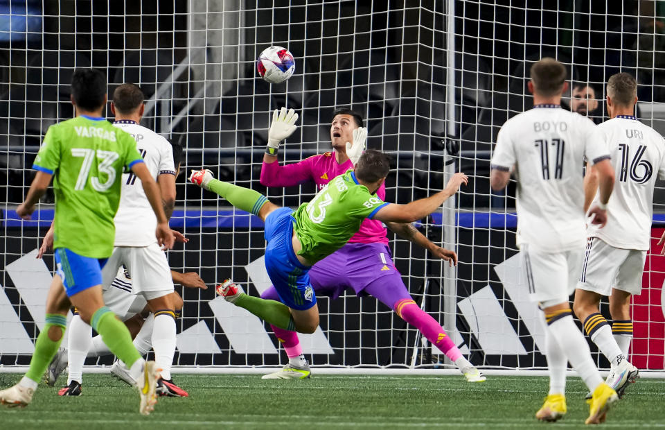 LA Galaxy goalkeeper Jonathan Bond (1) can't stop a goal by Seattle Sounders forward Jordan Morris (13) during the first half of an MLS soccer match Wednesday, Oct. 4, 2023, in Seattle. (AP Photo/Lindsey Wasson)